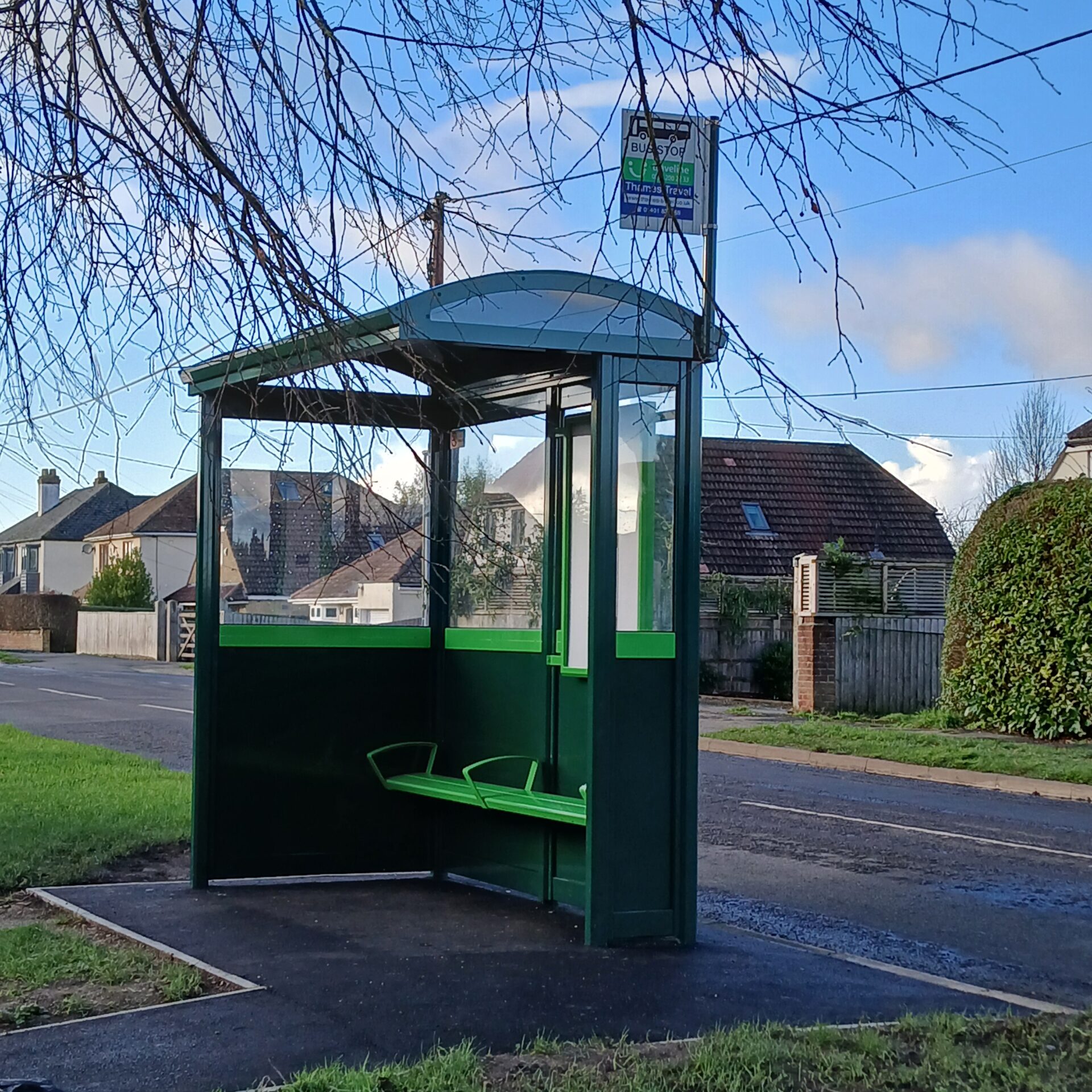 The dark green bus shelter on Milton Road.